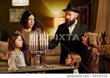 Jewish Family Lighting Menorah Candle 95415528