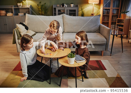 Three Sisters Playing Dreidel Three Sisters Playing Dreidel 95415536