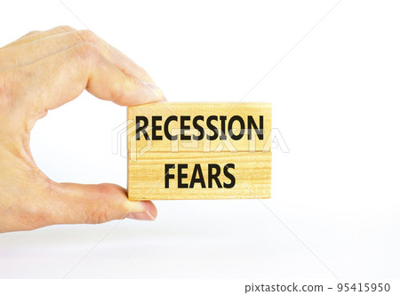 Recession fears symbol. Concept words Recession fears on wooden blocks on a beautiful white table white background. Businessman hand. Business and recession fears concept. Copy space. 95415950