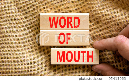 Word of mouth symbol. Concept words Word of mouth on wooden blocks on a beautiful canvas table canvas background. Businessman hand. Business, finacial and word of mouth concept. Copy space. Word of mouth symbol. Concept words Word of mouth on wooden blocks on a beautiful canvas table canvas background. Businessman hand. Business, finacial and word of mouth concept. Copy space. 95415963