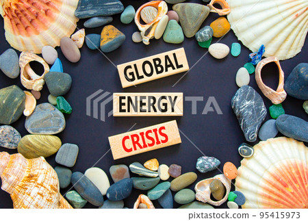 Global energy crisis symbol. Concept words Global energy crisis on wooden blocks. Sea stone, seashell. Beautiful black table black background. Business and global energy crisis concept. Copy space. 95415973