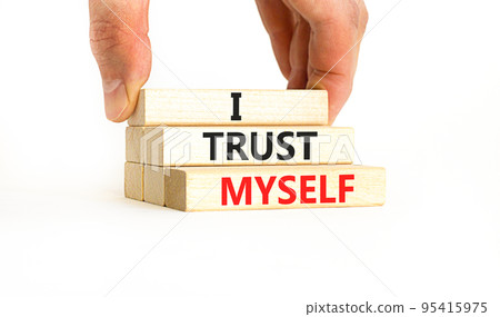 I trust myself symbol. Concept words I trust myself on wooden blocks. Businessman hand. Beautiful white table white background. Business, psychological and I trust myself concept. Copy space. I trust myself symbol. Concept words I trust myself on wooden blocks. Businessman hand. Beautiful white table white background. Business, psychological and I trust myself concept. Copy space. 95415975