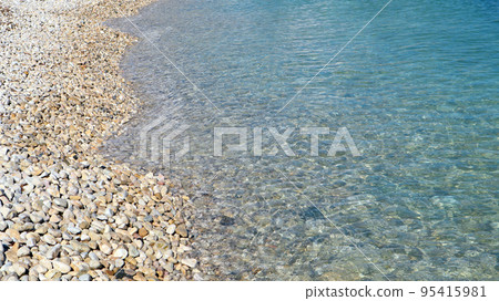 Transparent blue sea, pebble beach, beautiful sea background, seascape, seaside vacation, sea wallpaper Transparent blue sea, pebble beach, beautiful sea background, seascape, seaside vacation, sea wallpaper 95415981