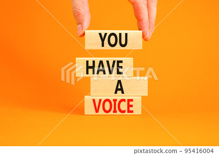 You have a voice symbol. Concept words You have a voice on wooden blocks. Beautiful orange table orange background. Businessman hand. Business, psychological you have a voice concept. Copy space. You have a voice symbol. Concept words You have a voice on wooden blocks. Beautiful orange table orange background. Businessman hand. Business, psychological you have a voice concept. Copy space. 95416004
