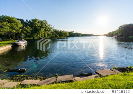 Toronto, Ontario, Canada - July 30 2021 : Toronto Islands Park Centre Island Long Pond. Toronto, Ontario, Canada - July 30 2021 : Toronto Islands Park Centre Island Long Pond. 95416133