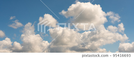 Large cluster of clouds against the blue sky 95416693