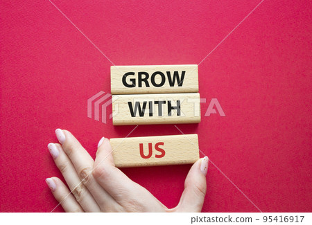 Grow with us symbol. Wooden blocks with words Grow with us. Beautiful red background. Businessman hand. Business and Grow with us concept. Copy space. Grow with us symbol. Wooden blocks with words Grow with us. Beautiful red background. Businessman hand. Business and Grow with us concept. Copy space. 95416917