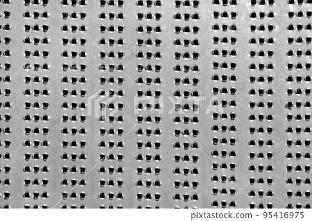 the metal plate with holes use for decorate floor or wall, perforated steel surface of metal texture background close-up view. the metal plate with holes use for decorate floor or wall, perforated steel surface of metal texture background close-up view. 95416975