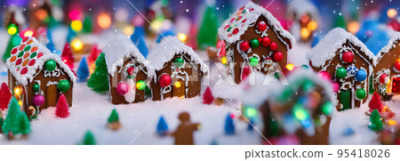 Abstract gingerbread fairy town village with bokeh and christmas lights as advent decoration. Banner size. 3d 95418026