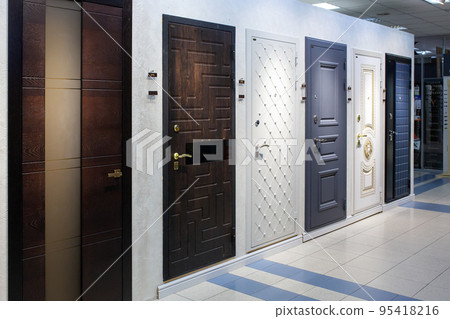 Shop window of doors. A large selection of doors for house. 95418216