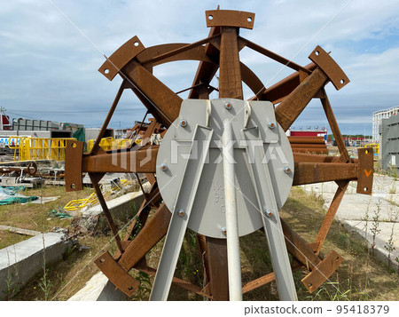 A large industrial mixer for a chemical plant or an open-air mining and processing plant for storing materials and industrial equipment A large industrial mixer for a chemical plant or an open-air mining and processing plant for storing materials and industrial equipment 95418379