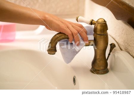 Girl in rubber gloves is cleaning bathroom. Girl in rubber gloves is cleaning bathroom. 95418987