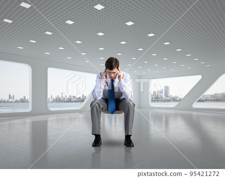 young businessman on chair in office 95421272
