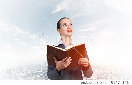 Young attractive woman with a diary 95421346