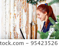Happy caucasian youn woman portrait. Using laptop. 95423526