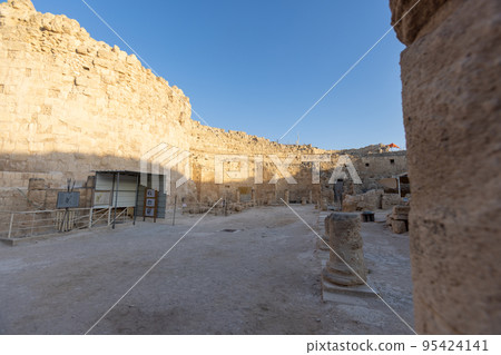 Mount Herodion and the ruins of the fortress of King Herod inside an artificial crater. The Judaean Desert, West Bank. 95424141