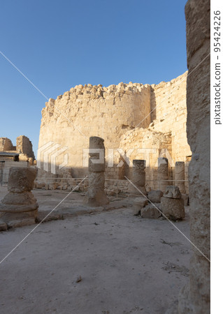 Mount Herodion and the ruins of the fortress of King Herod inside an artificial crater. The Judaean Desert, West Bank. 95424226