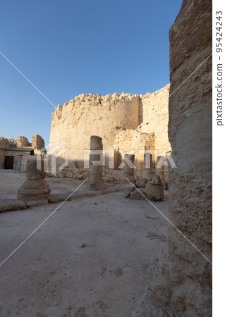 Mount Herodion and the ruins of the fortress of King Herod inside an artificial crater. The Judaean Desert, West Bank. 95424243
