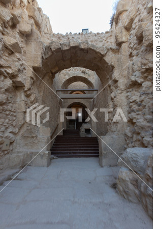 Mount Herodion and the ruins of the fortress of King Herod inside an artificial crater. The Judaean Desert, West Bank. 95424327