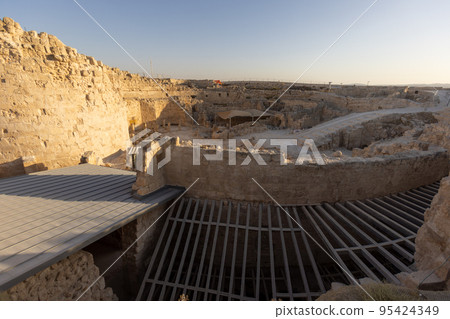 Mount Herodion and the ruins of the fortress of King Herod inside an artificial crater. The Judaean Desert, West Bank. 95424349