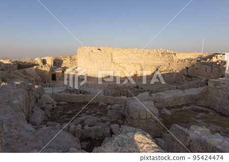 Mount Herodion and the ruins of the fortress of King Herod inside an artificial crater. The Judaean Desert, West Bank. 95424474
