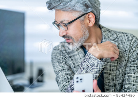 Businessman, middle class, elegant appearance, cell phone, smartphone Businessman, middle class, elegant appearance, cell phone, smartphone 95424480