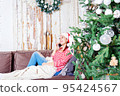 Young caucasian woman talking phone. Christmas time. 95424567