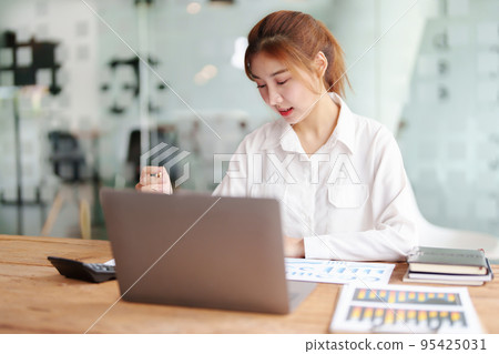 data analysis, plan, marketing, accounting, audit, Portrait of asian business woman planning marketing using statistical data sheet and computer to present marketing plan project at meeting data analysis, plan, marketing, accounting, audit, Portrait of asian business woman planning marketing using statistical data sheet and computer to present marketing plan project at meeting 95425031