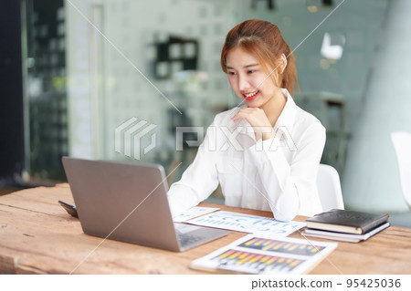 data analysis, plan, marketing, accounting, audit, Portrait of asian business woman planning marketing using statistical data sheet and computer to present marketing plan project at meeting 95425036