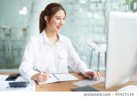 data analysis, plan, marketing, accounting, audit, Portrait of asian business woman planning marketing using statistical data sheet and computer to present marketing plan project at meeting 95425139