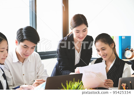 Start-up Business, a team of young entrepreneurs working together to increase profits into the company to increase business potential. 95425334