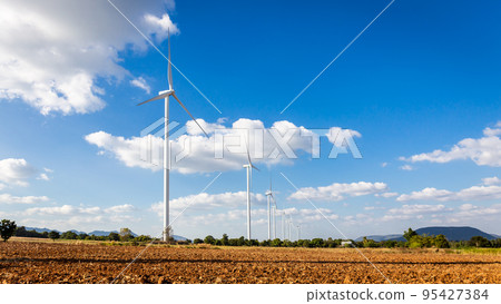 Landscape of Wind turbine arranged in a row on a mountain with blue sky background in Sikhio District, Nakhon Ratchasima, Thailand Landscape of Wind turbine arranged in a row on a mountain with blue sky background in Sikhio District, Nakhon Ratchasima, Thailand 95427384