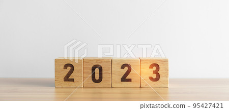 2023 year block on table background. goal, Resolution, strategy, plan, start, budget, mission, action, motivation and New Year concepts 95427421
