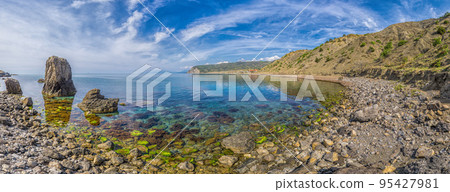 Panoramic View of Cape Ai-Fock, Veselovskaya bay and the beach of the village of Vesyoloe in the Crimea. On the foreground is the western foot of Mount Karaul-Oba. Azure Black Sea near Sudak Panoramic View of Cape Ai-Fock, Veselovskaya bay and the beach of the village of Vesyoloe in the Crimea. On the foreground is the western foot of Mount Karaul-Oba. Azure Black Sea near Sudak 95427981
