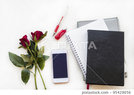 notebook planner, mobile for business work with rose flowers notebook planner, mobile for business work with rose flowers 95429056