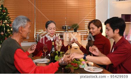 Image of happy family praying before holiday dinner at home. Christmas, New year, thanksgiving, holidays and celebration concept Image of happy family praying before holiday dinner at home. Christmas, New year, thanksgiving, holidays and celebration concept 95429939