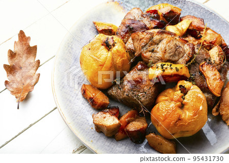 Meat baked with apples and quince Meat baked with apples and quince 95431730