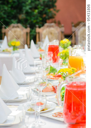 Served table with different dishes and drinks Served table with different dishes and drinks 95431806