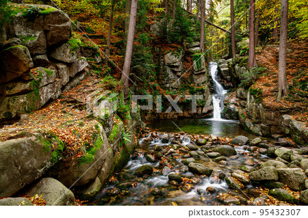 Nature landscape. Waterfall. Beautiful fall mountain wild Forest waterfall with green moss cover stones. Forest autumn landscape. Scenery of nature 95432307