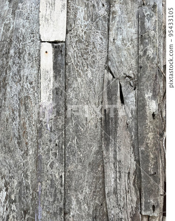 Old wood planks texture background due to exposure to weather, vertical view. 95433105