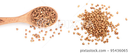 buckwheat grain in wooden spoon isolated on white background close up. Top view buckwheat grain in wooden spoon isolated on white background close up. Top view 95436065