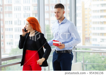 Happy business colleagues in modern office using laptop Happy business colleagues in modern office using laptop 95436136