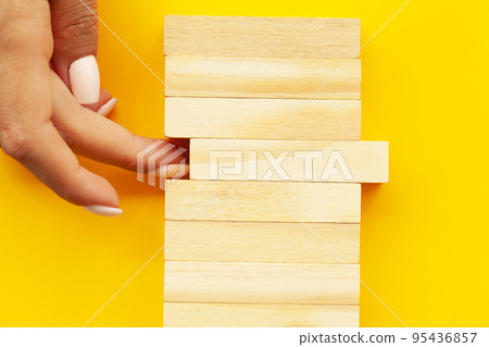 Close up woman's hand stacked wooden blocks with space for text Close up woman's hand stacked wooden blocks with space for text 95436857