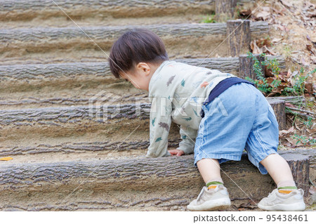 Boy climbing stairs Boy climbing stairs 95438461