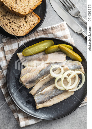 Marinated herring fish on plate. Marinated herring fish on plate. 95439373