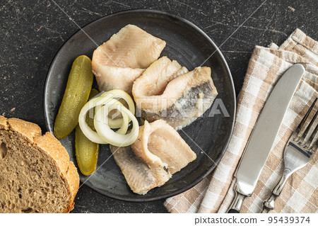 Marinated herring fish on plate. Marinated herring fish on plate. 95439374