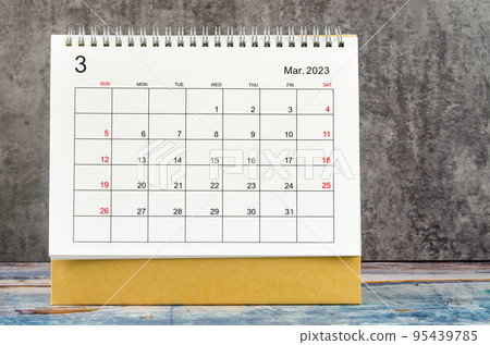 The March 2023 Monthly desk calendar for 2023 year on wooden table. 95439785
