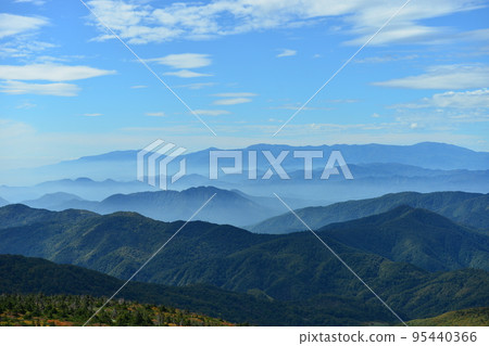 Autumn high sky and mountain surface starting to change color (Zao) 95440366