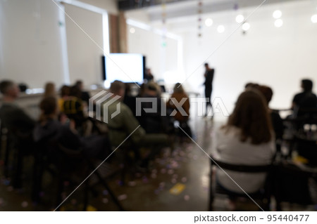 Blurred background of the business conference, one man on the stage, presentation of the project, public talk. High quality photo Blurred background of the business conference, one man on the stage, presentation of the project, public talk. High quality photo 95440477