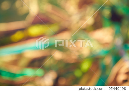 Blurry abstract modern holographic background in yellow tones in the style of the 80s. Crumpled iridescent foil of real texture. High quality photo Blurry abstract modern holographic background in yellow tones in the style of the 80s. Crumpled iridescent foil of real texture. High quality photo 95440498